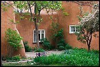 Garden and pueblo revival style building. Taos, New Mexico, USA