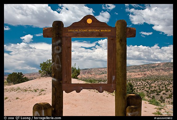 Historic marker framing high desert landscape. New Mexico, USA (color)