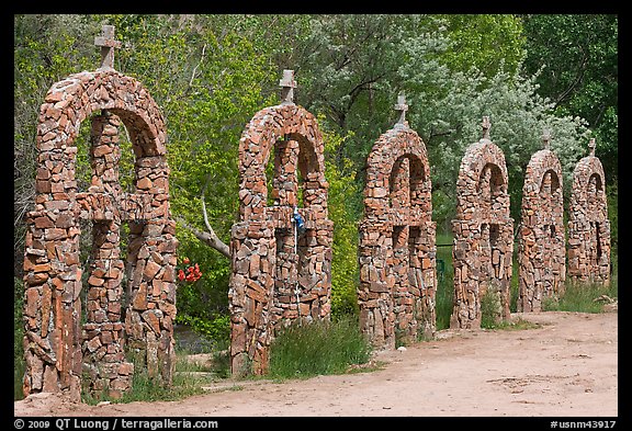 Brick and stone crosses by the river, Sanctuario de Chimayo. New Mexico, USA
