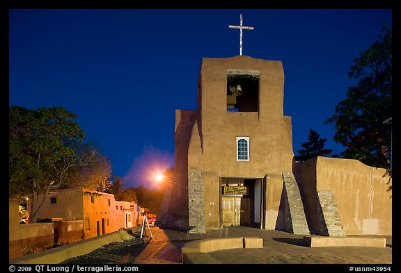 Oldest church and house in the US by night. Santa Fe, New Mexico, USA
