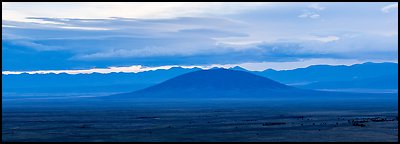 Ute Mountain, Taos Plateau, and Sangre de Cristo Mountains with rain clouds. Rio Grande Del Norte National Monument, New Mexico, USA (Panoramic color)