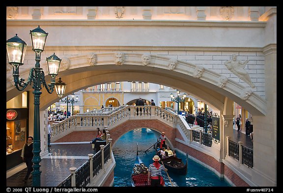 Gondolas passing below bridge, inside Venetian hotel. Las Vegas, Nevada, USA (color)