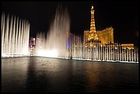 Bellagio fountains and Paris hotel by night. Las Vegas, Nevada, USA