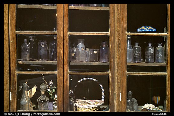 Old bottles in a store window, Austin. Nevada, USA