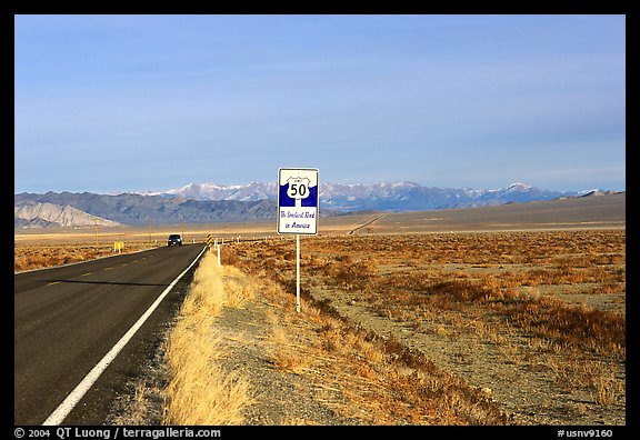 Sign reading Loneliest road in America. Nevada, USA (color)