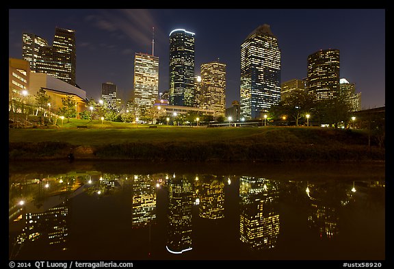 Dowtown skyline and reflection at night. Houston, Texas, USA (color)