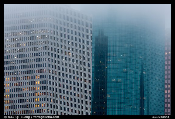 Top of high-rise buildings capped by fog. Houston, Texas, USA (color)