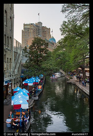 Riverwalk promenade, approaching barge. San Antonio, Texas, USA (color)