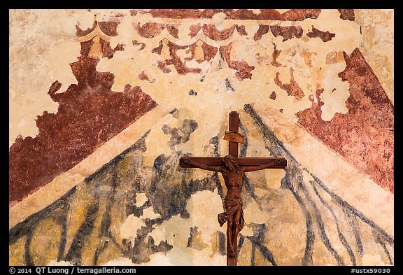 Fading fresco and crucifix. San Antonio, Texas, USA