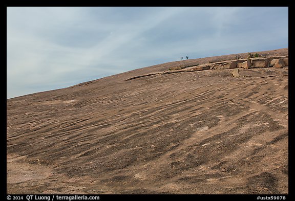Granite dome with hikers, Enchanted Rock. Texas, USA (color)