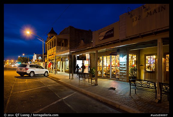 Stores at night. Fredericksburg, Texas, USA (color)