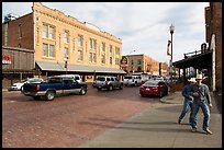 Stokyards street with brick buildings, men with cowboy hats. Fort Worth, Texas, USA ( color)