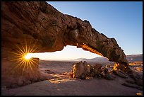 Sunstar through Sunset Arch. Grand Staircase Escalante National Monument, Utah, USA ( color)