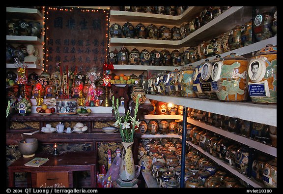 Temple room containing funeral urns with ashes of the deceased. Ho Chi Minh City, Vietnam (color)