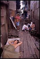 Sleeping late in a narrow alley. Ho Chi Minh City, Vietnam ( color)