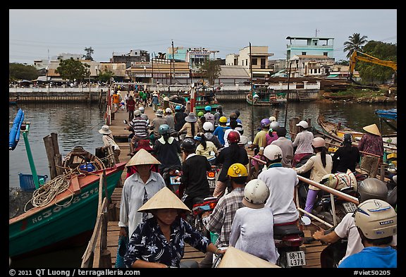 Crowd crossing the mobile bridge, Duong Dong. Phu Quoc Island, Vietnam (color)