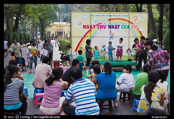 Children singing, Cong Vien Van Hoa Park. Ho Chi Minh City, Vietnam (color)