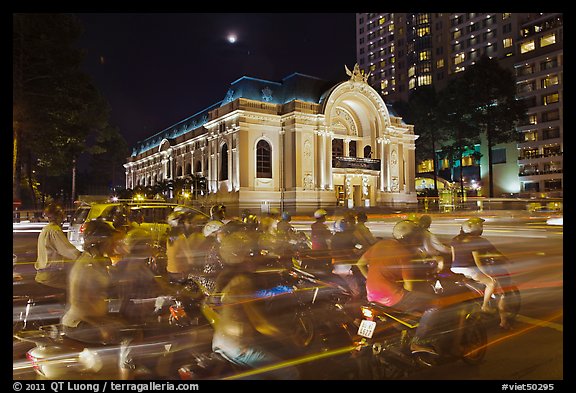Motorcycles and Opera House at night. Ho Chi Minh City, Vietnam