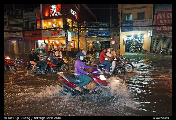 Street flooded by mooson rains at night. Ho Chi Minh City, Vietnam