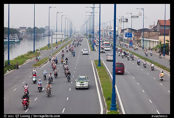 Busy expressway on banks of Saigon Arroyau. Cholon, Ho Chi Minh City, Vietnam