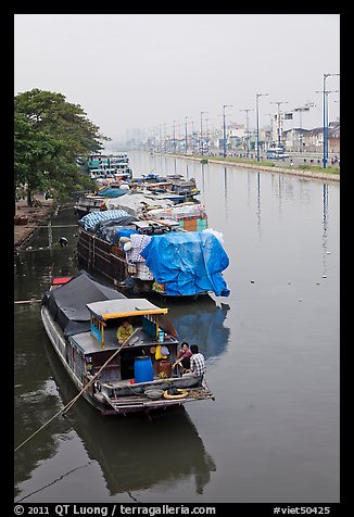 Mariners aboard barges, Saigon Arroyau. Cholon, Ho Chi Minh City, Vietnam (color)
