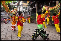 Dancers carry dragon on poles, Thien Hau Pagoda. Cholon, District 5, Ho Chi Minh City, Vietnam (color)
