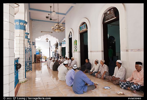 Men sharing food in gallery, Cholon Mosque. Cholon, District 5, Ho Chi Minh City, Vietnam