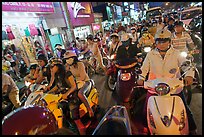 Street filled with motorcycles at rush hour. Ho Chi Minh City, Vietnam (color)