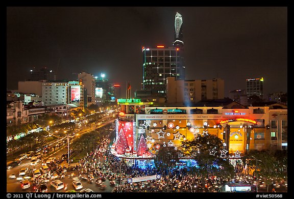 Cityscape with dense rush hour traffic at the intersection of two main boulevards. Ho Chi Minh City, Vietnam (color)