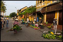 Fruit and vegetable vendors in old town. Hoi An, Vietnam (color)