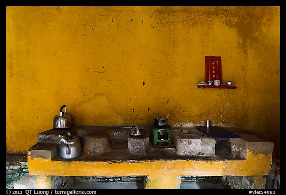 Yellow kitchen and altar. Hoi An, Vietnam