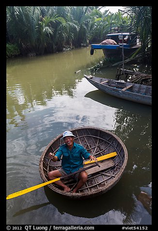 Man in circular boat near Cam Kim Village. Hoi An, Vietnam