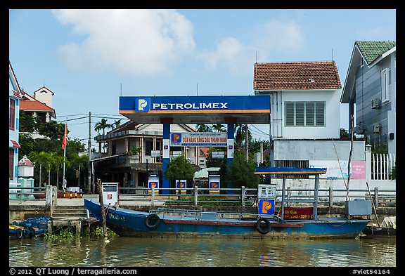 Road and river petrol station. Hoi An, Vietnam (color)
