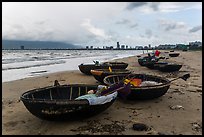 Coracle boats and city skyline. Da Nang, Vietnam (color)