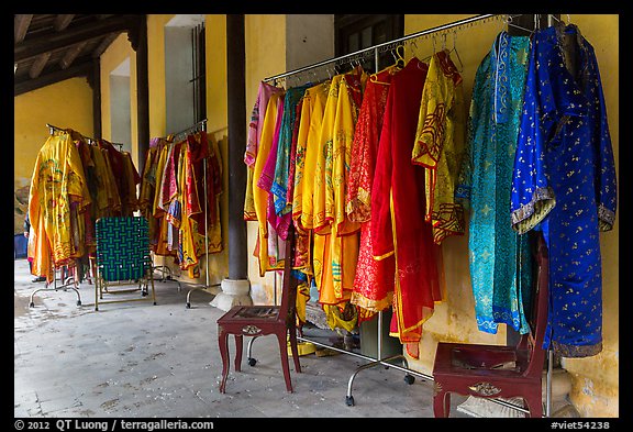 Coat hangers with silk robes in imperial style, citadel. Hue, Vietnam