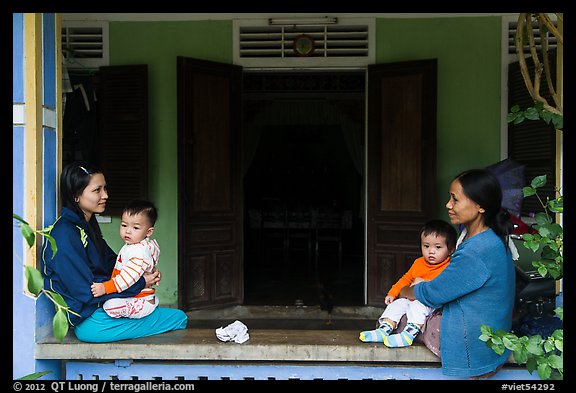 Mothers and infants on porch, Thanh Toan. Hue, Vietnam