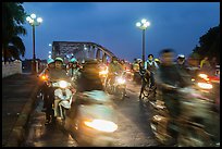 Night motorcyle traffic out of Trang Tien bridge. Hue, Vietnam ( color)