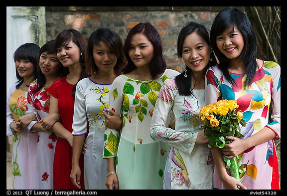 Row of women in Ao Dai, Temple of the Litterature. Hanoi, Vietnam