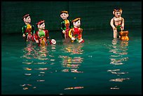 Water puppets (5 characters with musical instruments), Thang Long Theatre. Hanoi, Vietnam (color)