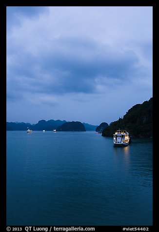 Tour boats lights at dawn. Halong Bay, Vietnam