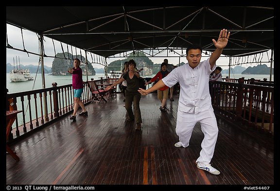 Morning Tai Chi session on tour boat deck. Halong Bay, Vietnam