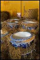 Ceramic vases wrapped in hay in storeroom. Bat Trang, Vietnam ( color)