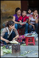 Woman roasting corn in the street. Bat Trang, Vietnam ( color)