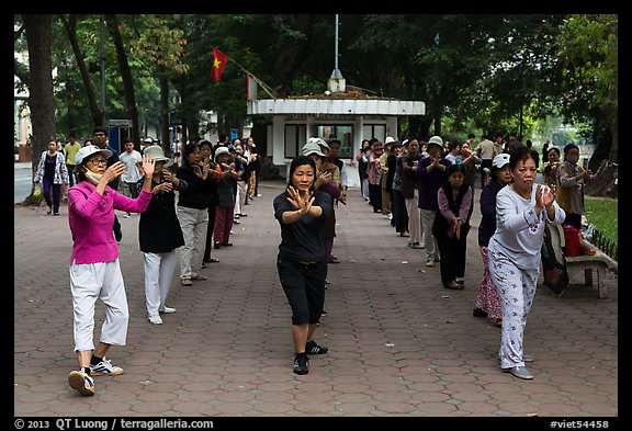 Women practising Tai Chi on shores of Hoang Kiem Lake. Hanoi, Vietnam