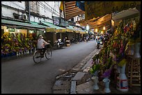 Street with flower sellers in early morning, old quarter. Hanoi, Vietnam (color)