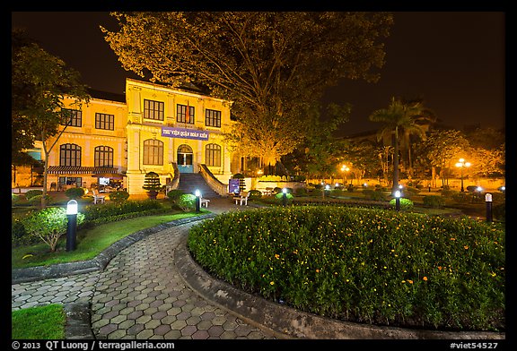 Public garden and French-area building at night. Hanoi, Vietnam (color)
