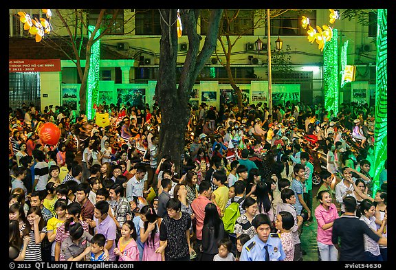 Street with Christmas eve crowds. Ho Chi Minh City, Vietnam