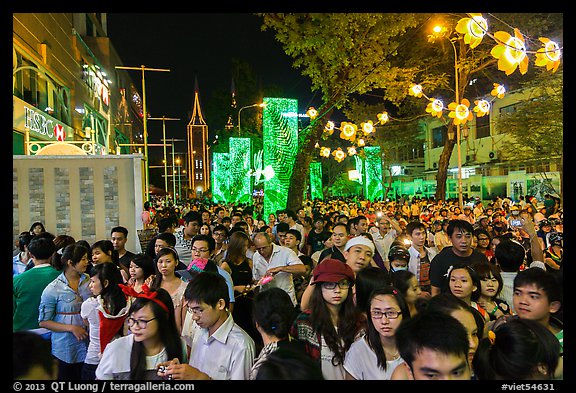 Street filled with crowds on Christmas eve. Ho Chi Minh City, Vietnam