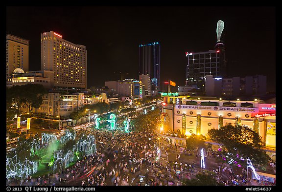 Crowded intersection at night from above, during holidays. Ho Chi Minh City, Vietnam (color)