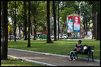 Relaxing on a public bench in April 30 Park. Ho Chi Minh City, Vietnam